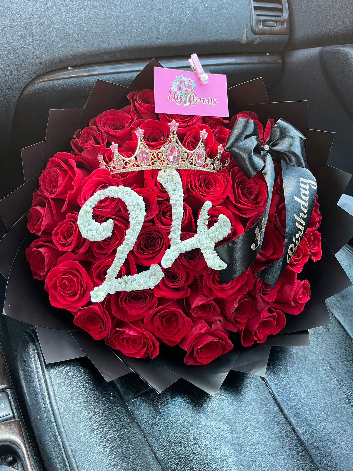Red rose bouquet in black paper