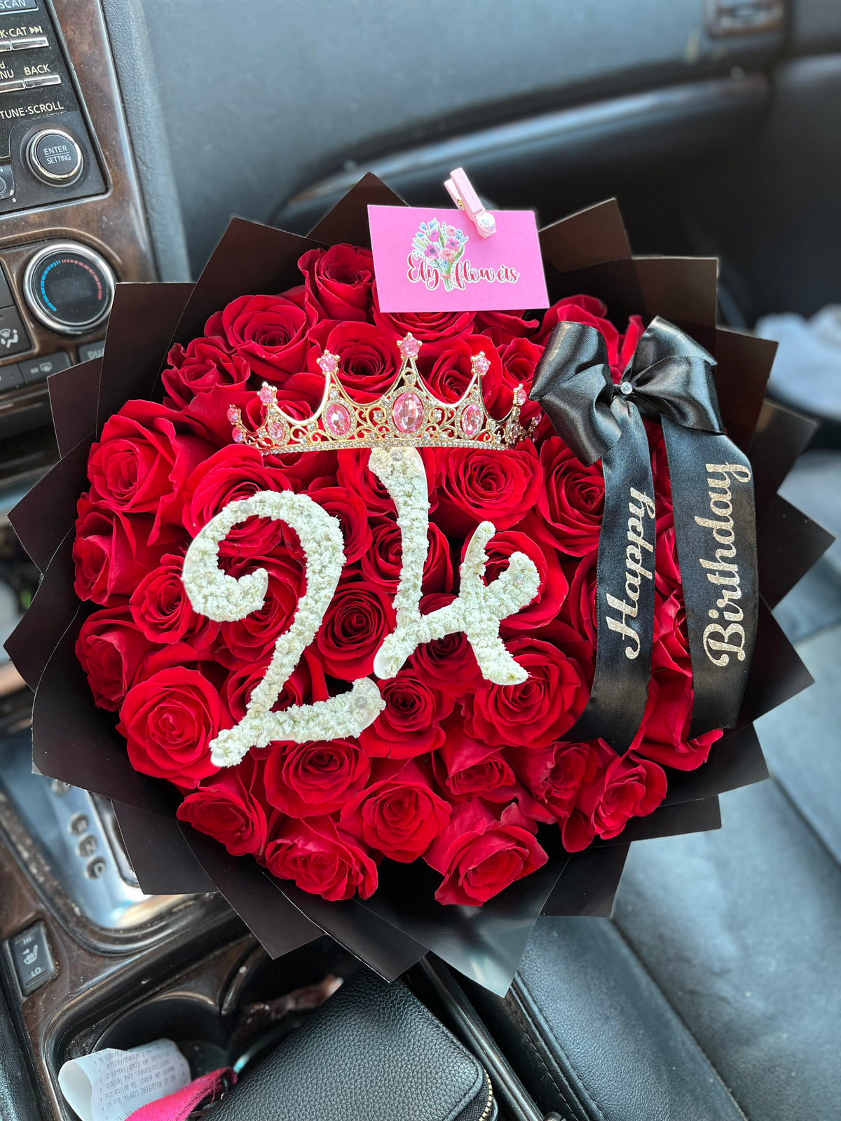 Red rose bouquet in black paper