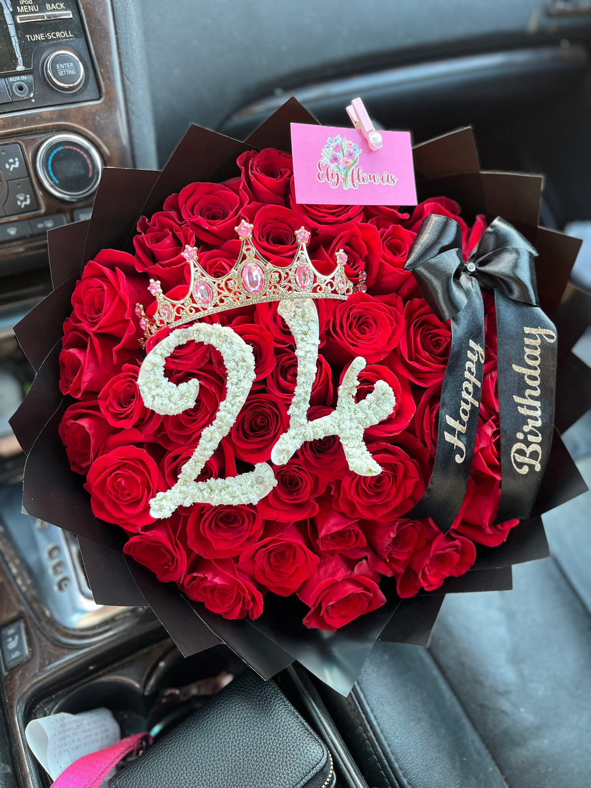Red rose bouquet in black paper